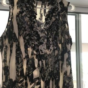 Sleeveless ruffled front top